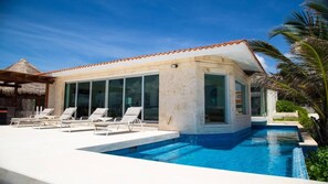 View from the beach to pool & pool deck