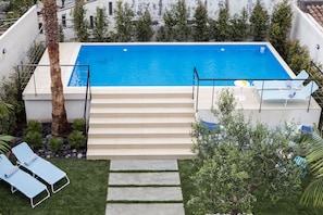 private gardens and swimming pool