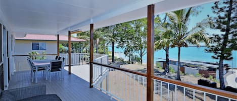 View to the beach and huge sand spit for family walking  from upstairs verandah 