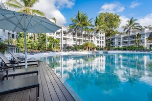 The resort's main pool offers ample loungers and a swim-up cabana. 