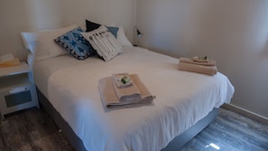Master bedroom super comfie queen bed.