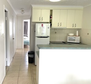 View from dining through kitchen towards bedrooms