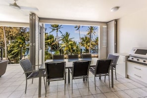 An undercover balcony encourages alfresco dinners cooked on the BBQ—all while enjoying the sea breeze and beachfront views.