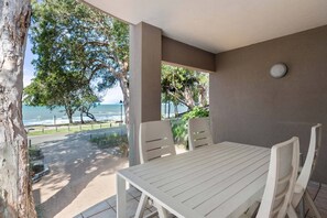 Unwind on the outdoor patio with breathtaking beach views. Embrace the tranquility of the coastal ambiance as you bask in the refreshing sea breeze.