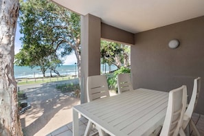 Unwind on the outdoor patio with breathtaking beach views. Embrace the tranquility of the coastal ambiance as you bask in the refreshing sea breeze.
