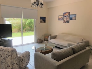 Living Area with TV and patio view