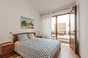 Bedroom with balcony and lounge area