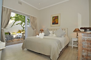 2nd bedroom leading onto courtyard with view over False Bay