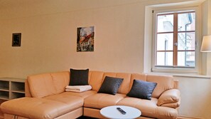 Living area with sofa bed, size 130 x 180 cm and two twin beds