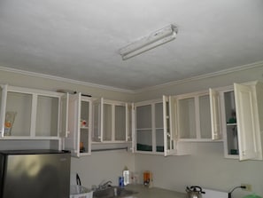 cupboards above countertop in kitchen etc