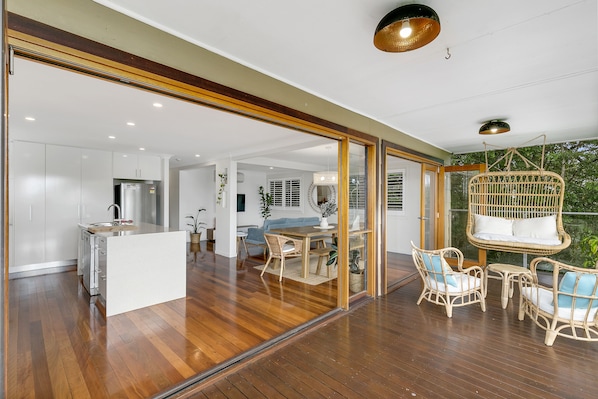 Open plan living, kitchen and dining areas which flow to the top deck