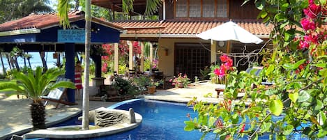 Montezuma Beach Villa with pool and the ocean in front of house.
