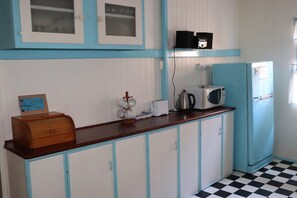 The spacious kitchen is fully equipped