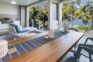 Soak up the Far North Queensland sunshine from your private balcony, offering a spacious eight-seater table and cosy lounge.