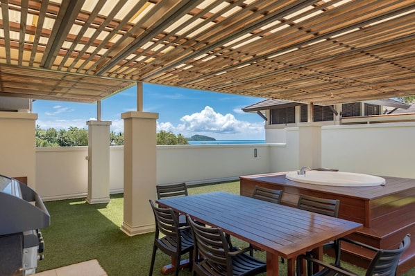 Your private undercover rooftop is set with a BBQ grill and six-seater table for alfresco dining. 