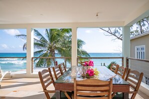 Terrace with beach beds and a big table for 8 persons. 