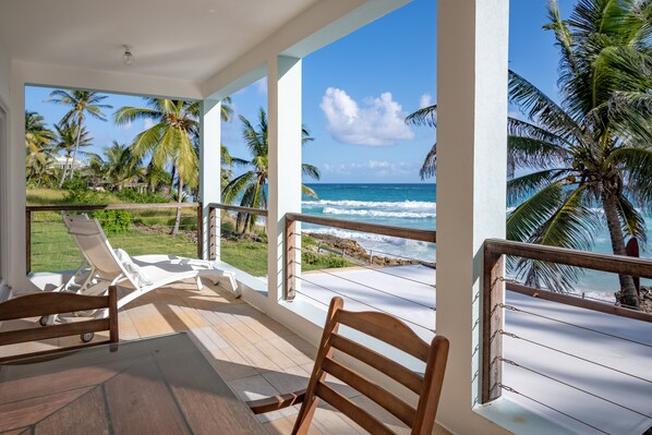 Terrace with beach beds and a big table for 8 persons. 