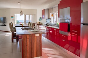 Scavolini Kitchen with island and dining area. 