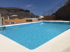 Roof Top Pool with vast sunbathing area, with free parasols and sun beds