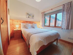 Double bedroom with fitted wardrobe and blackout blinds.