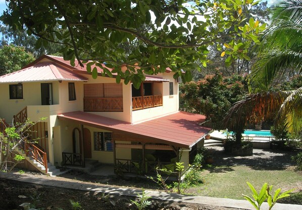 External view of building with common swimming pool and shared garden
