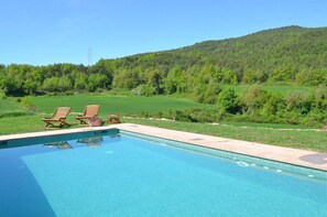 Cool off in the pool og relax in the sunbeds with this marvellous view