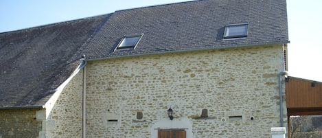 Rear view Old Stable Gite showing private patio with BBQ and table/chairs