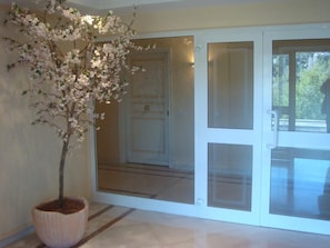 Entrance lobby to Maryland 2. Stairs on left and lift through doors.apartment.