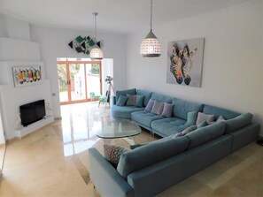 Sitting room with TV and Conservatory