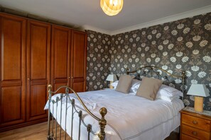 front bedroom has double bed and single with truckle bed below