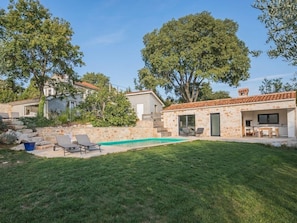 main building on top with the garden studio and swimming pool underneath