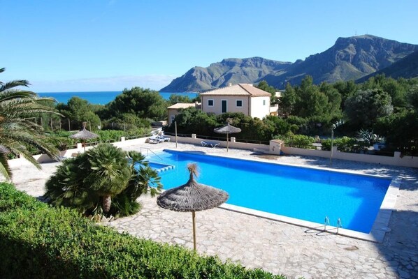 View from the house of the swimming pool and the sea and mountains