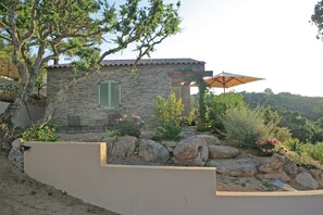 The landscaped rock garden under the oak tree