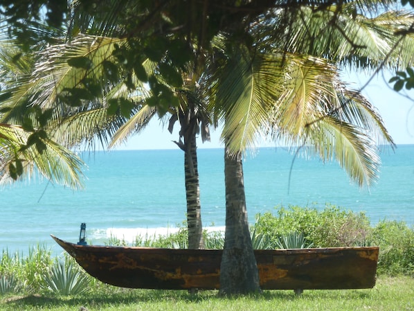 Have a drink in our sofa-boat looking at the turquoise waters...