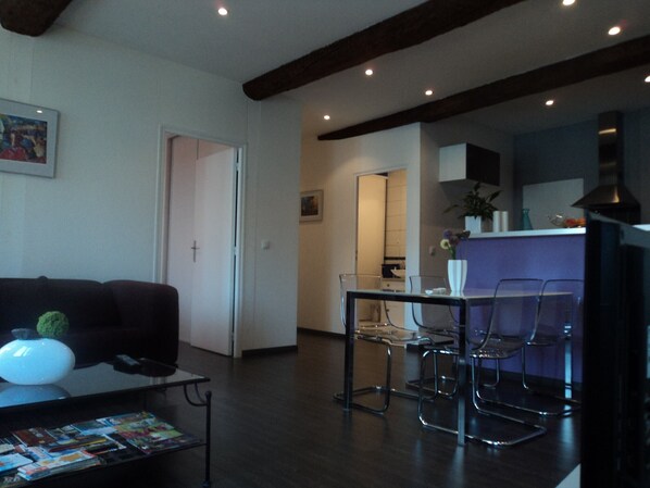 Living room/kitchen (right)/lit shower room (back)