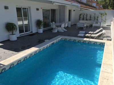 Design apartment with large terrace, garden and private pool.