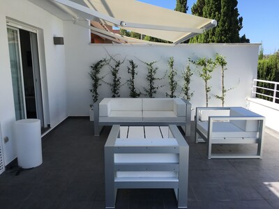 Design apartment with large terrace, garden and private pool.