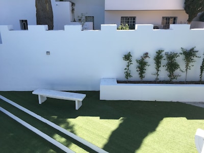 Design apartment with large terrace, garden and private pool.