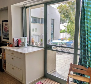 The kitchen has 2 glass doors leading to the huge balcony.