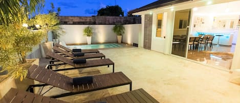 The terrace with private pool and lounge area