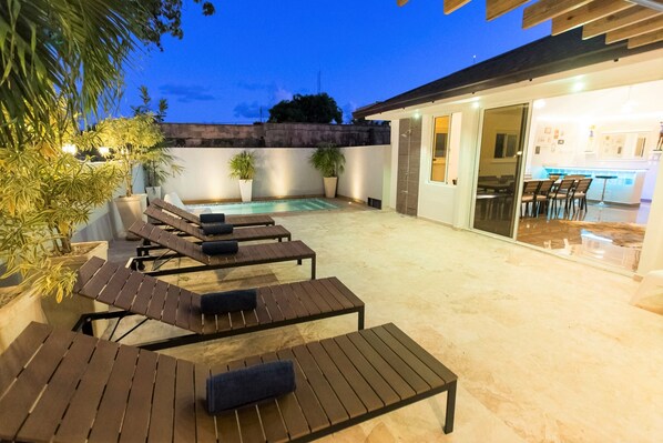 The terrace with private pool and lounge area