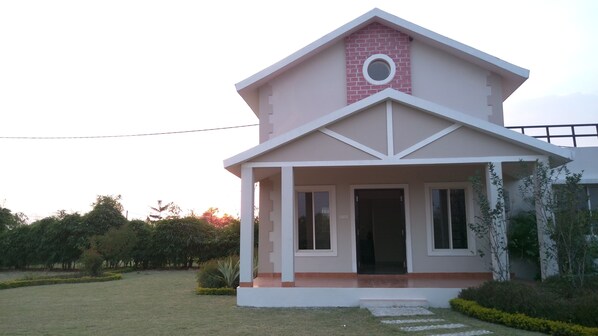 Cottage with Green environs.