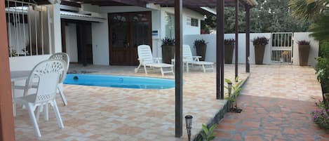 Terrace outside living room and pool area