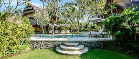 View of the pool and Villa Kayu.