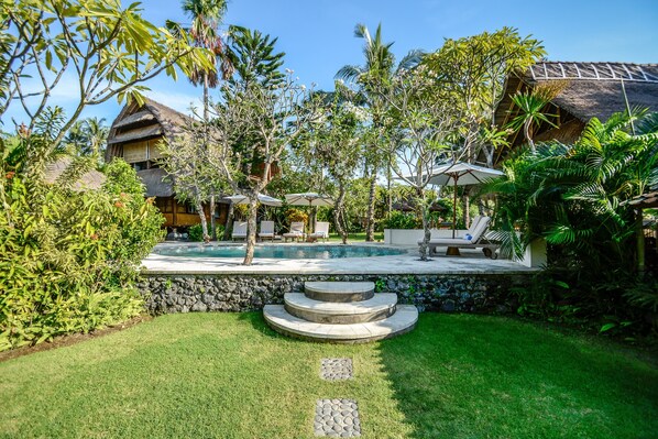 View of the pool and Villa Kayu.