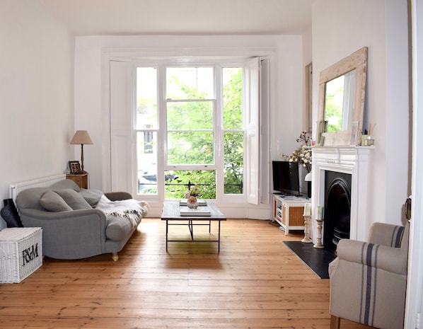 Living area (with double wooden doors to master bedroom)