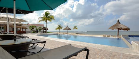Guests of Casa Catarina get relax poolside and enjoy the spectacular ocean views