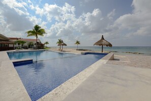 Relax at Costa del Sol's Infinity pool with shallow end perfect for kids