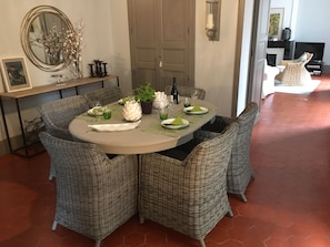 The dining, entrance hall links to the kitchen and living room by double doors.