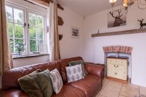 Living area which leads into the kitchen.